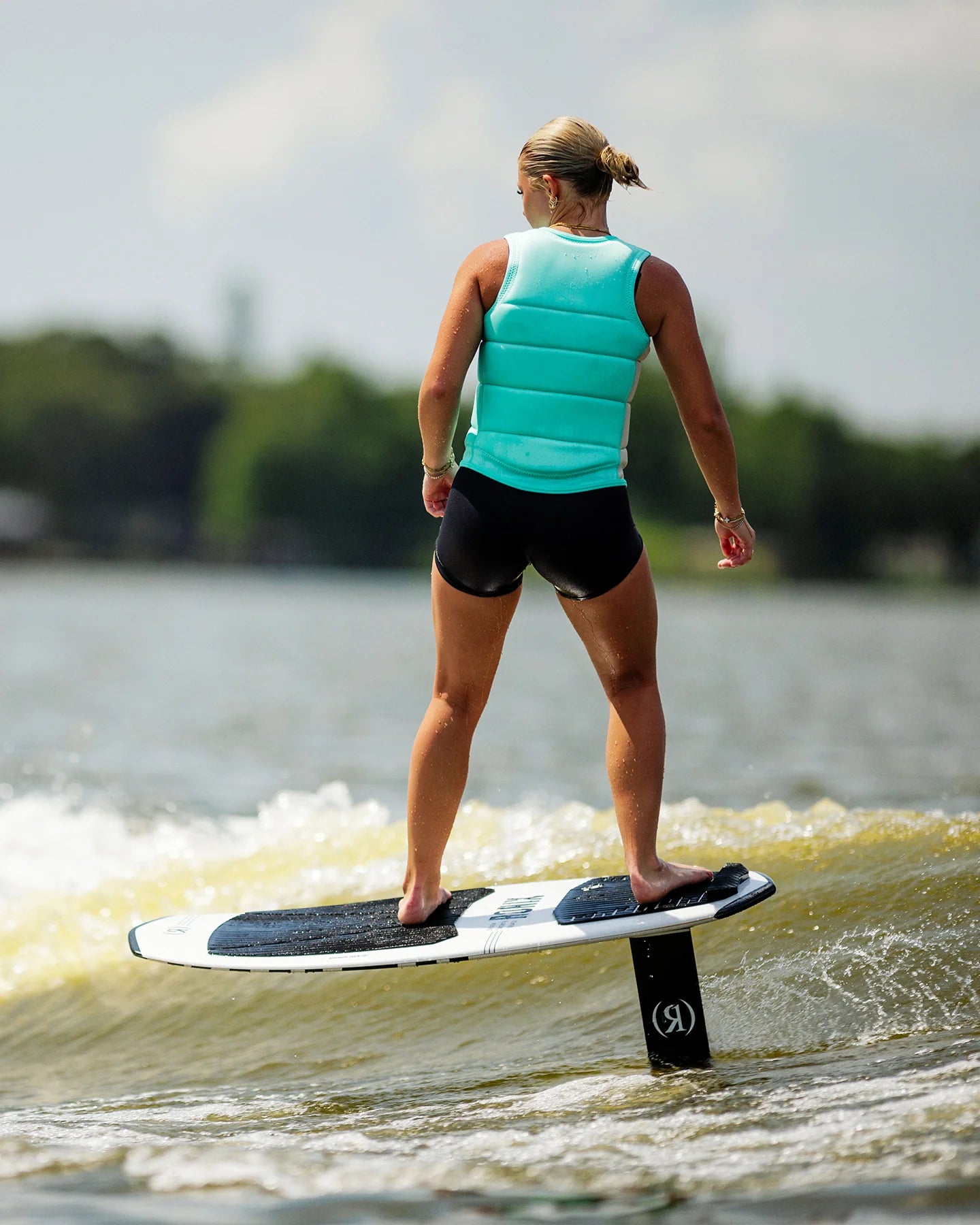 Follow Corp Women's Wake Impact Vest Mint - on-water action shot 4
