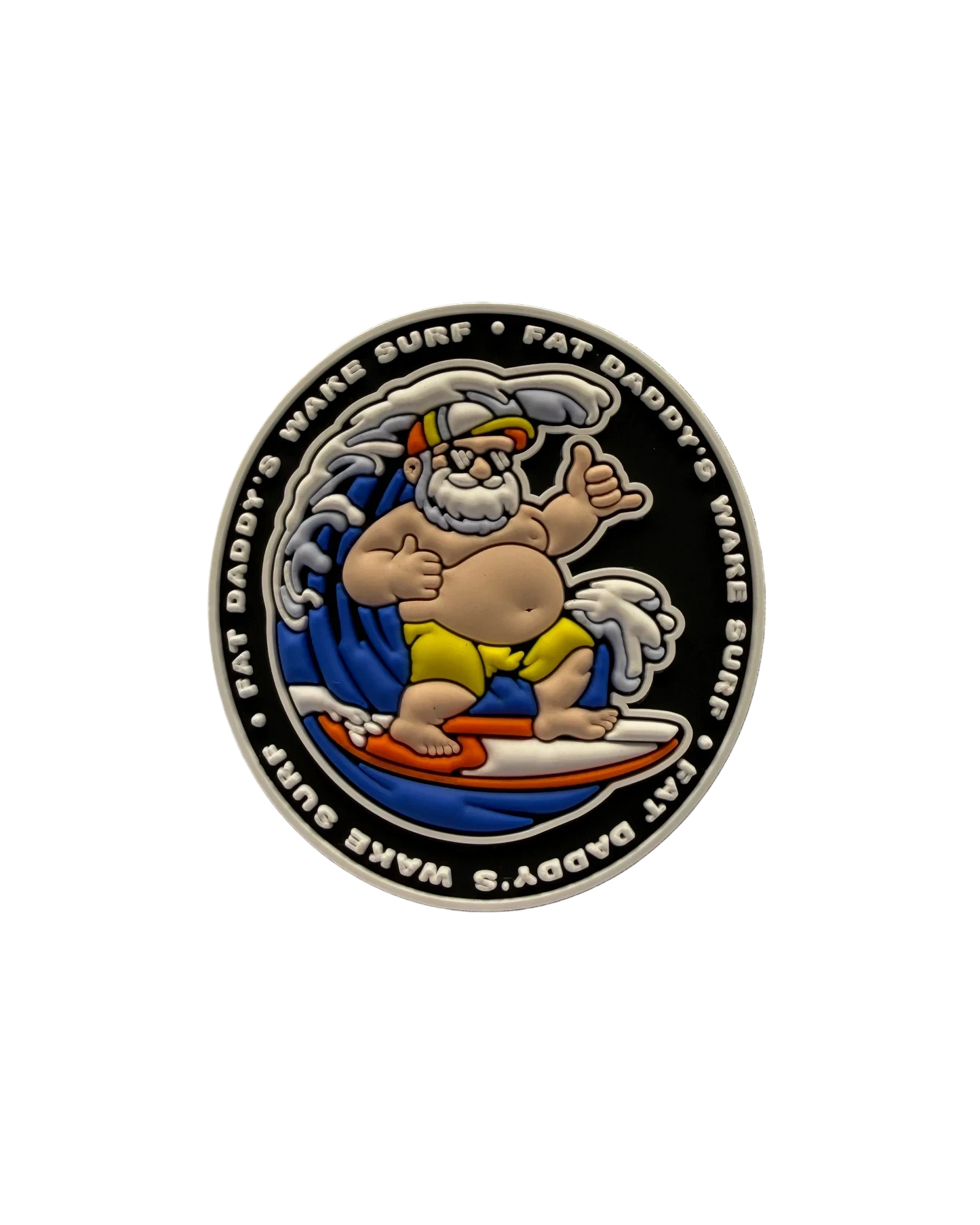 A circular enamel coin or medallion featuring a cartoon surfer character on a white surfboard against a black background, with the text 'FAT DADDY'S WAVE SURF' around the edge.